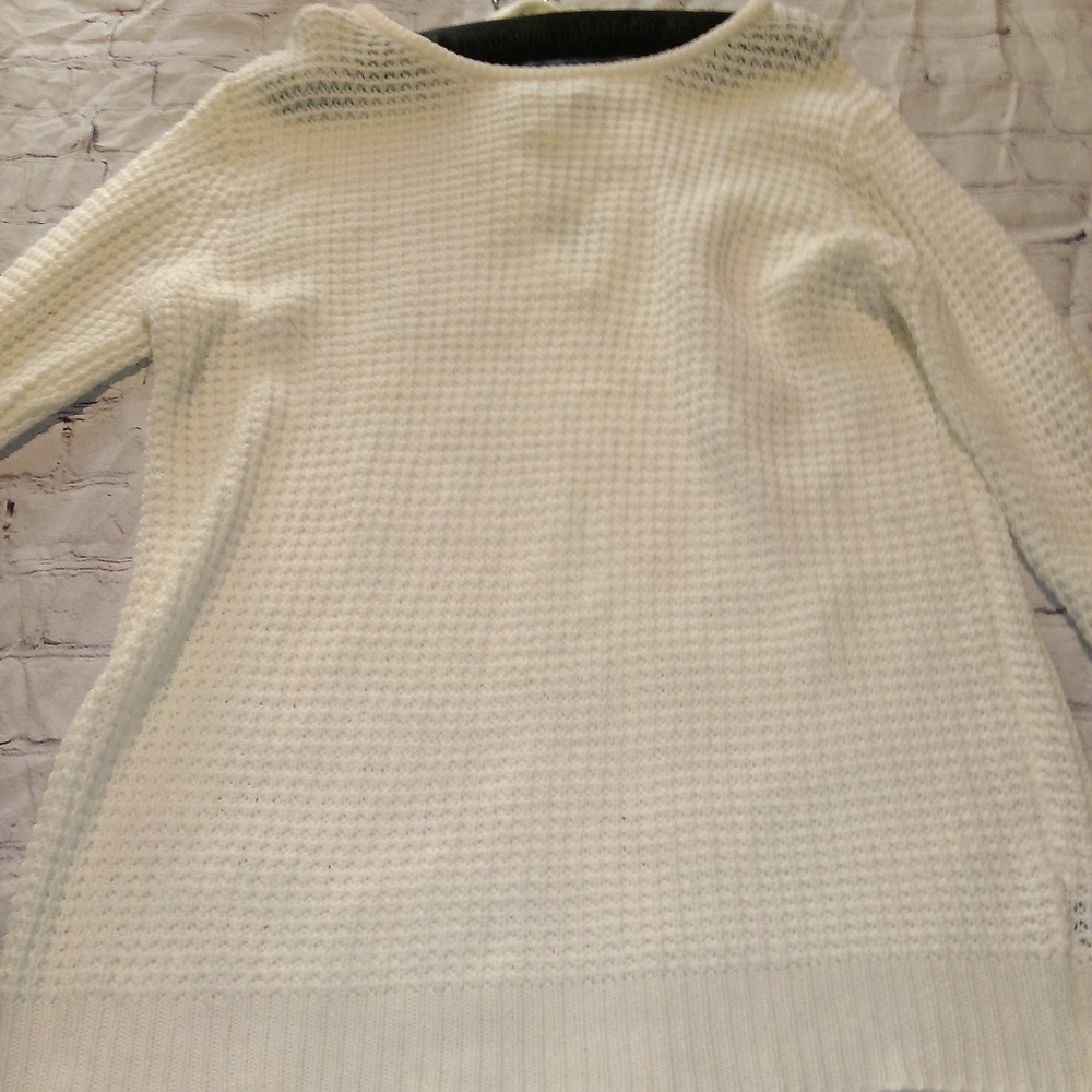 Long off white sweater with a beautiful back.